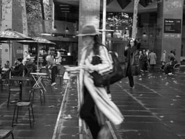 While all others are frozen, a woman is in motion. Martin Place, Sydney