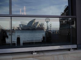 Sydney Opera House reflected in windows.