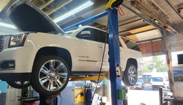 a white truck is parked in a garage