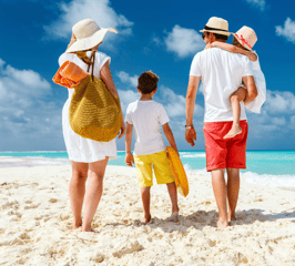 a family of three children walking on the beach