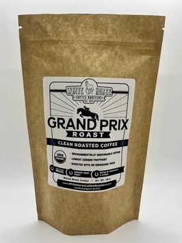 A brown bag with a logo that says White Horse Coffee Grand Prix Roast on it