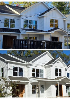 Front view of a house featuring modern standing seam metal roofing and gutter upgrades