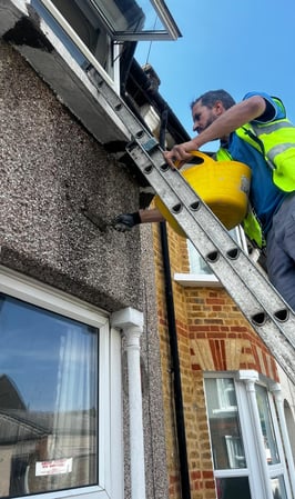 on the long ladder wall repair