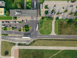 a city street intersection with a lot of cars parked on the side of the road