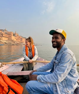 My Indian guide and me on a boat ride along the Ganges River in Varanasi, India.