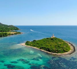 Panoramic shot of Alcanada Island, a key stop on Balea Charters boat tours in Mallorca