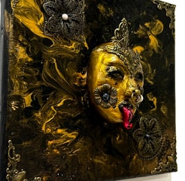 a painting of a gold mask on a white background