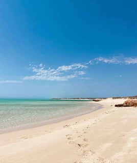 Beautiful Sand Beach with white sand and clear water near Exmouth, Western Australia.