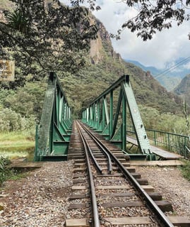 Green bridge and train tracks on the Aguacalientes trail to Hydroeléctrica in Peru.