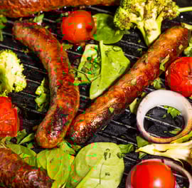 Sustainable plant-based, nutritionally-dense, hypoallergenic protein and fibre sausages with vegetables surrounding