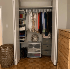 An "after" picture of a bedroom closet neatly organized.