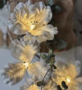 a vase with flowers and a vase with a vase on it