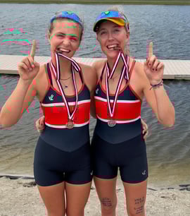 Maija and Anna Andert wearing their gold medals for their win in the pair at the American Youth Cup