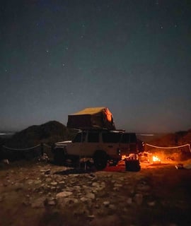 Landcruiser, campsite and night fire near Wedge in Western Australia.