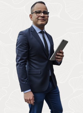 a man in a suit and tie with a tablet