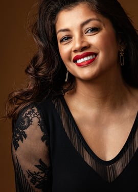 a woman with a red lipstick and a black top