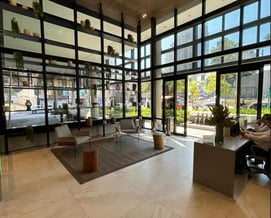 a large open space with a large window and a view of a city