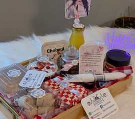 a tray of food and a bottle of wine