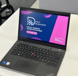 Laptop opened on Kent DigiFest powerpoint