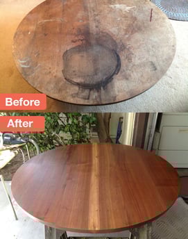 a table with a wooden table top and a table with a chair
