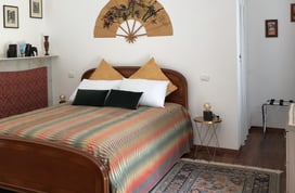 spot of bedroom at the azalea apartment at villa ombrosa