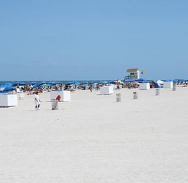 South beach miami florida daytime with umbrellas and a lifeguard tower