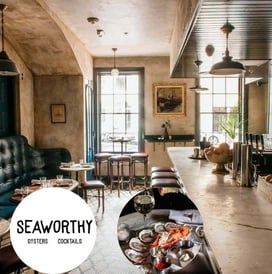 a restaurant with a table and chairs and a table with food