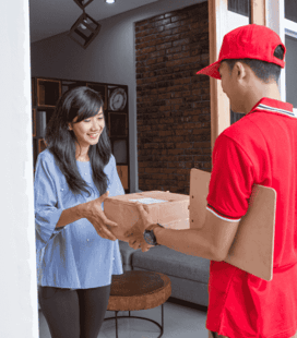 a man and woman are delivering pizzas to a customer