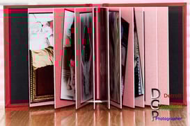 An authors open book showing the pages and a hint of images. #Commercial Product Photography, #Detroit Product Photography,