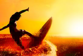 a man is surfing on a surfboard in the ocean