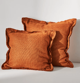 two brown pillows with ruffled edges