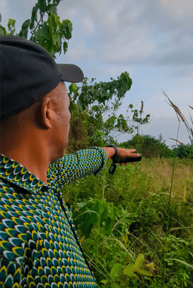 Our guide pointing at wildlife in the Gabonese bush.