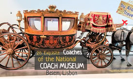 Beige & black coach decorated with royal crown & sign that says '28 coaches of National Coach Museum