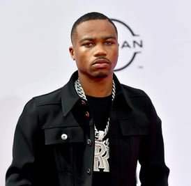 Roddy Ricch in designer streetwear at a music video shoot