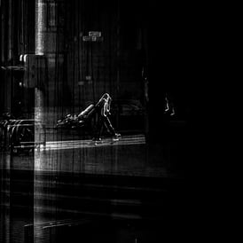 A man, with a ghost like shadow, taken through glass at The Usher Hall. Edinburgh