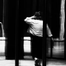 A woman reflected in glass at Exchange Place, Edinburgh