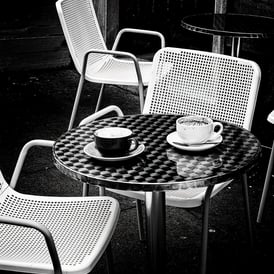 Two empty coffee cups on a table outside a cafe on Marchmont Road, Edinburgh