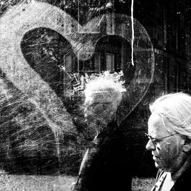 Two women walk past a bus shelter on Palmerston Place, Edinburgh