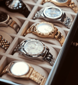 a box of watches with a variety of watches