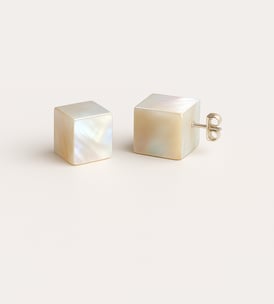 a pair of white pearl stud earring