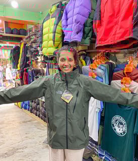 Trying on sportswear in the Thamel neighborhood of Kathmandu.