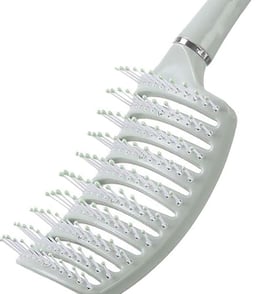 a brush brush with a white comb and a white comb