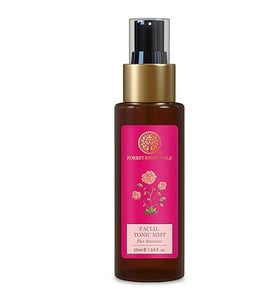 a bottle of body lotion with a pink rose on it