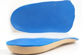 a pair of blue shoes with a blue shoe sole sole