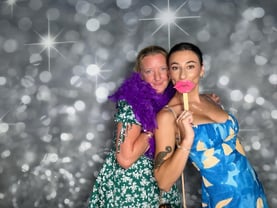 Photo booth fun at Jucinta and Herbies engagement party with the purple feather boa and props in Manly, Brisbane.