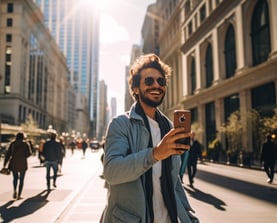 a man in a blue jacket and sunglasses is taking a selfie in Chicago