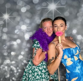 Photo booth fun at Jucinta and Herbies engagement party with the purple feather boa and props in Manly, Brisbane.