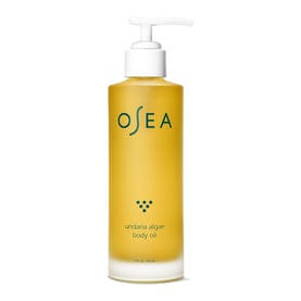 a bottle of oceane body lotion with a pump of liquid
