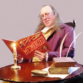 Actor costumed as Benjamin Franklin reading Mesmerized