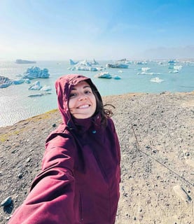 Eva in front of icebergs in Iceland.